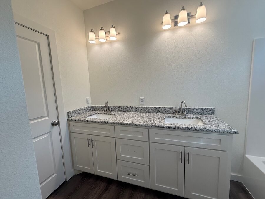 A double vanity with the granite, mirror and fittings cleaned