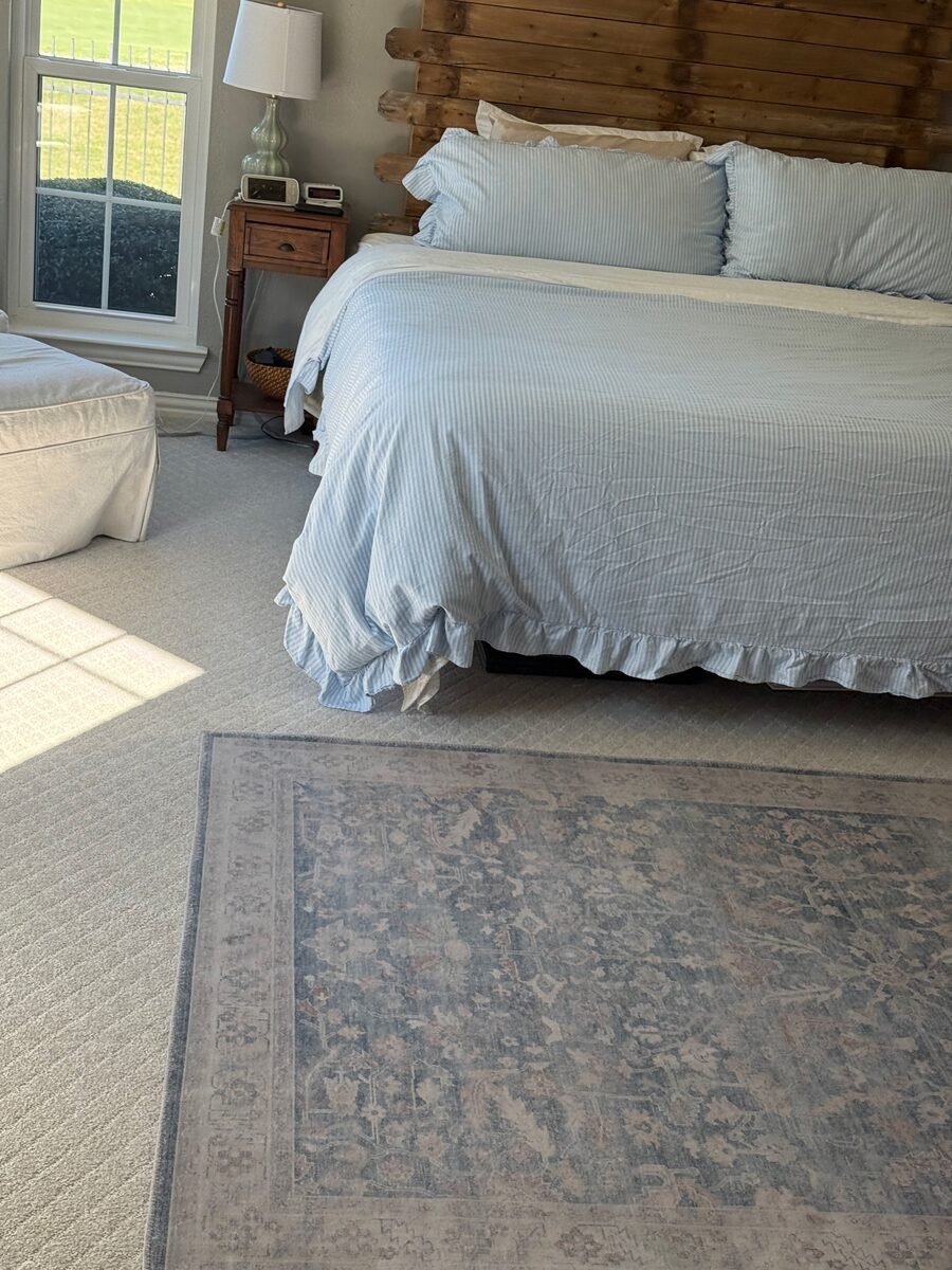 a bed made up with clean linens in a Lucas home cleaned by SusyQ’s Cleaning