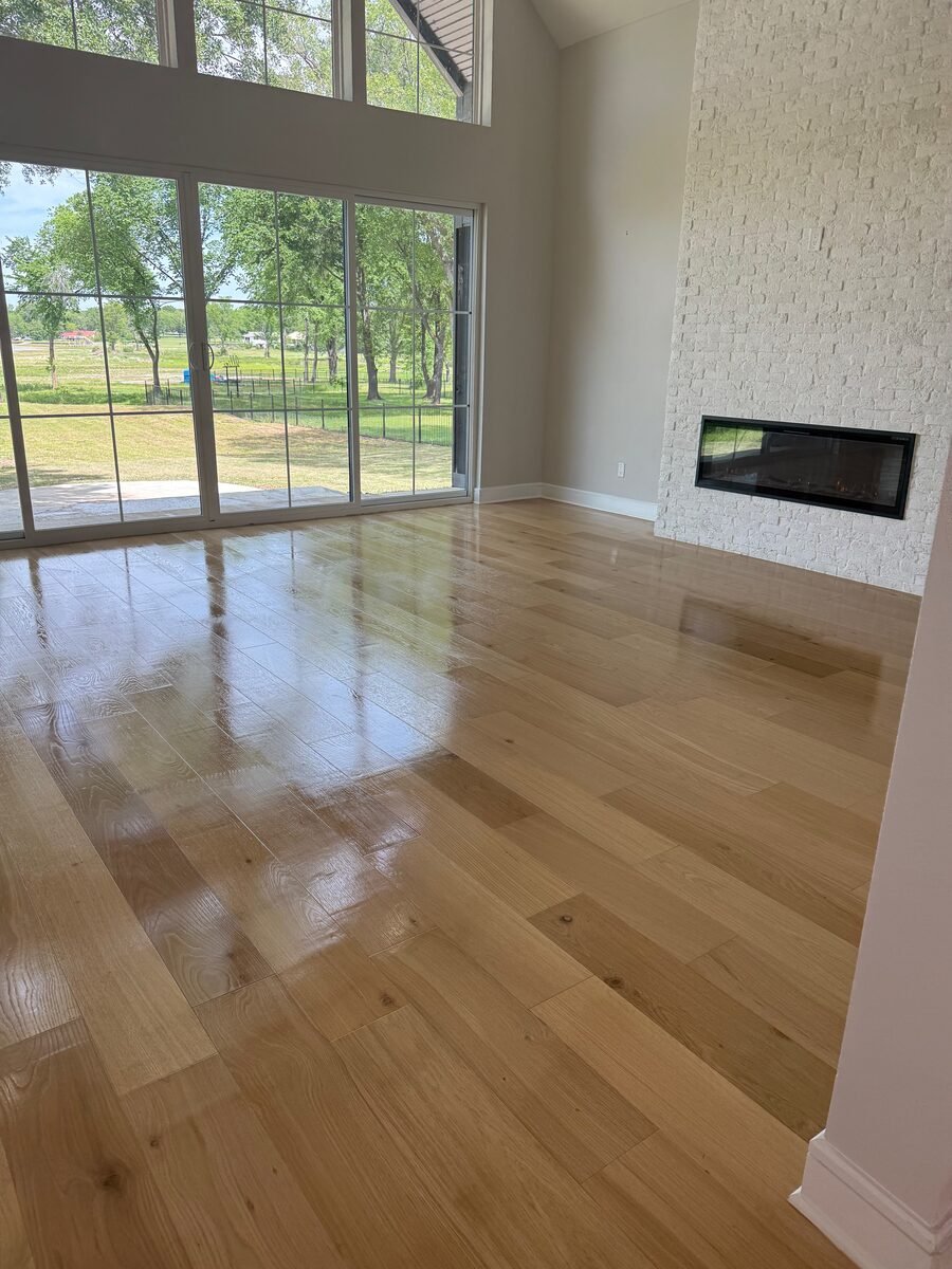 an open living area with polished hardwood floors in a Coppell home cleaned by SusyQ’s Cleaning