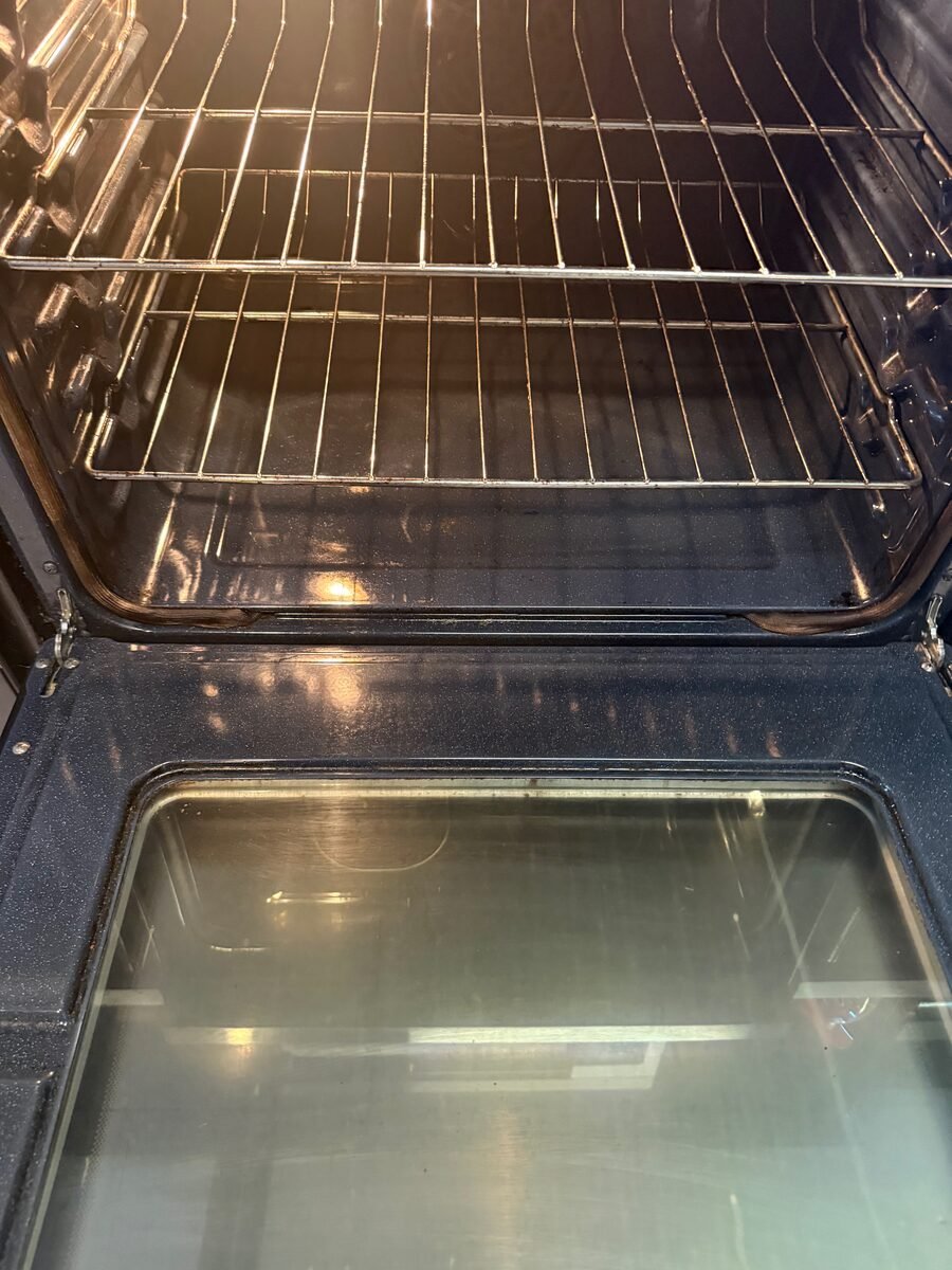 An oven interior cleaned back to bare enamel and chrome